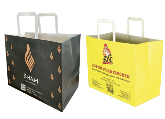 Bedruckte Papiertragetaschen in den Designs von SHAM und Zürich Fried Chicken